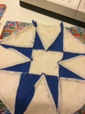 backside of quilt square, with hand stitching visible